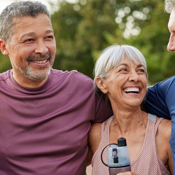 Active seniors walking together outdoors with comfort and support